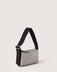 The graf lantz Campus Shoulder Bag is a small, gray, rectangular bag against a plain background. It has a black adjustable strap attached with metal buckles for durability and features a zipper closure and subtle logo on the front, perfect for carrying everyday essentials.