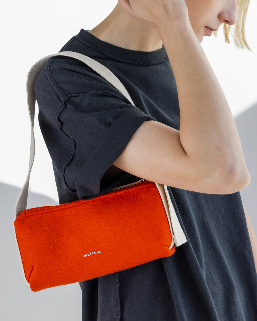 Casual enough for day, sleek enough for night and the adjustable strap lets it fit no matter what the look: our  Campus Shoulder Bag, here in orange