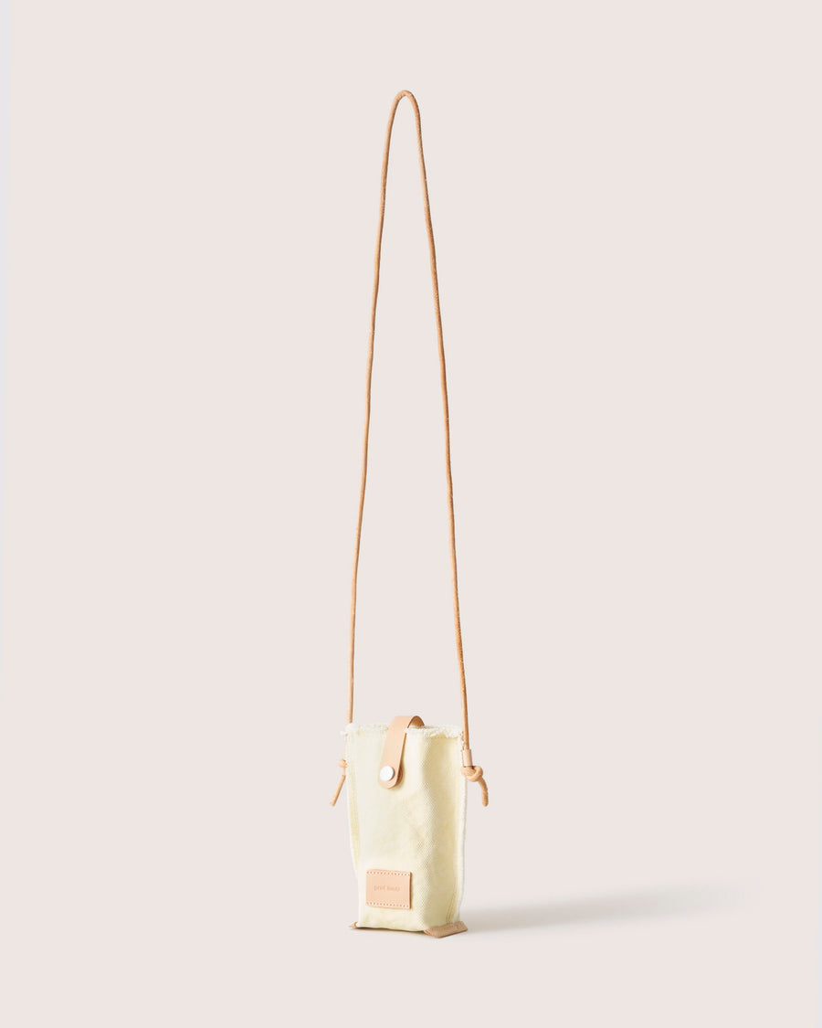 Sized for all phone models: our Hana Canvas Phone Crossbody. Here in limoncello color