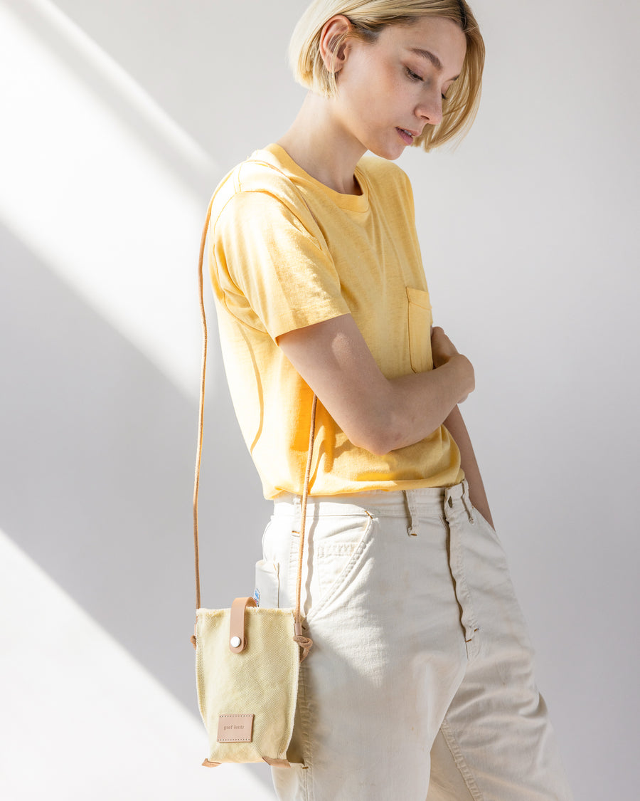 Sized for all phone models: our Hana Canvas Phone Crossbody. Here in limoncello color