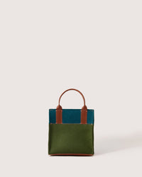 Moss and Kombu colored Jaunt Merino Wool Mini Tote with brown leather handles, side view, white background