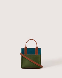 Jaunt Merino Wool Mini Tote in Moss and Kombu with brown leather strap, front view, white background
