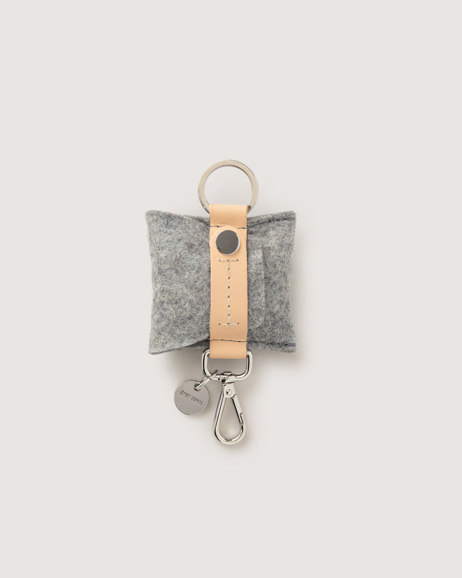 The Pod Fob holds your keys and pods. Here in granite color