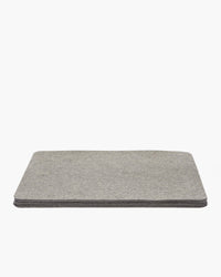 A stack of gray rectangular felt pads from graf lantz evokes a designer-inspired look against a white background.