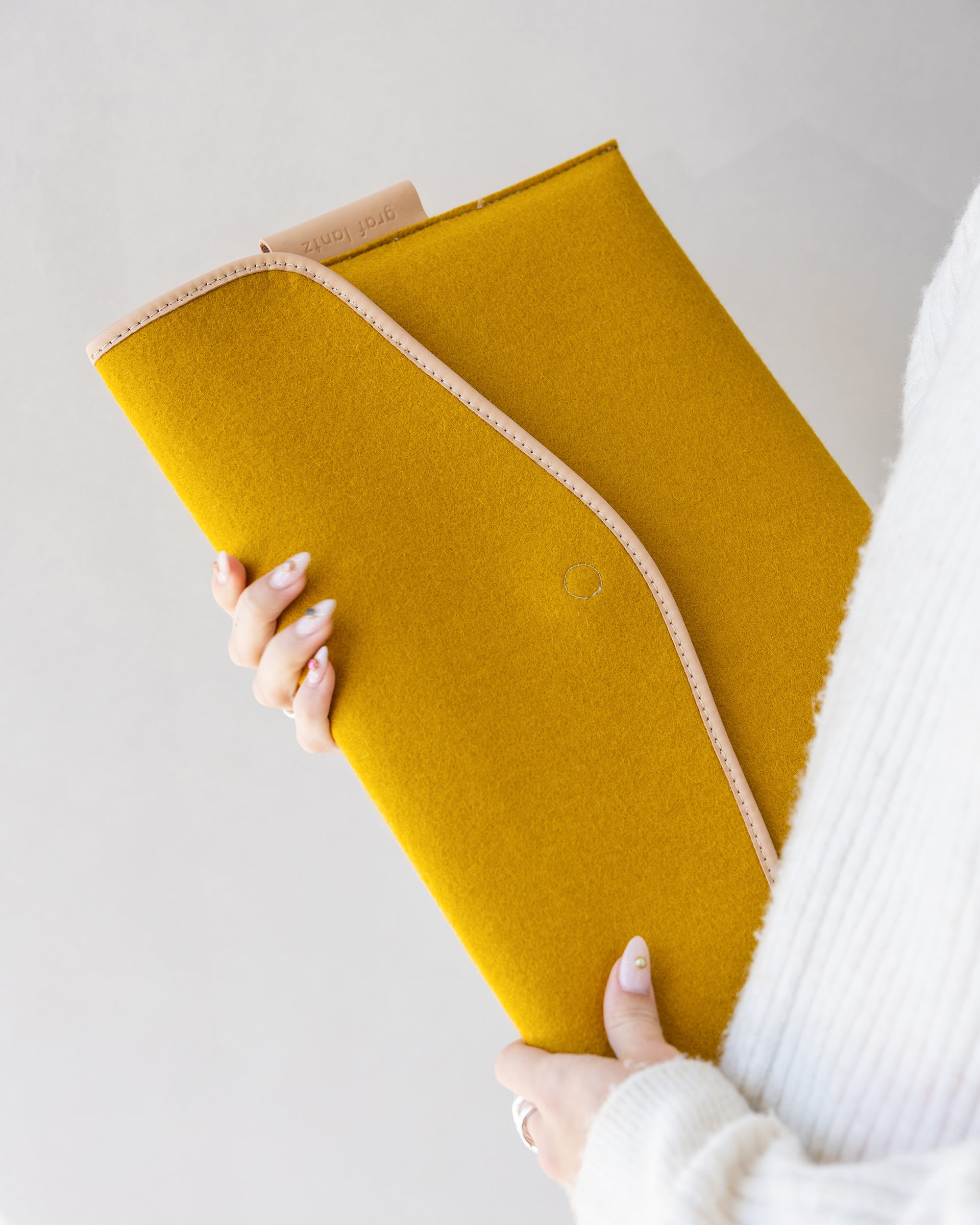 Our 16 inch laptop sleeve. Here in dijon color.