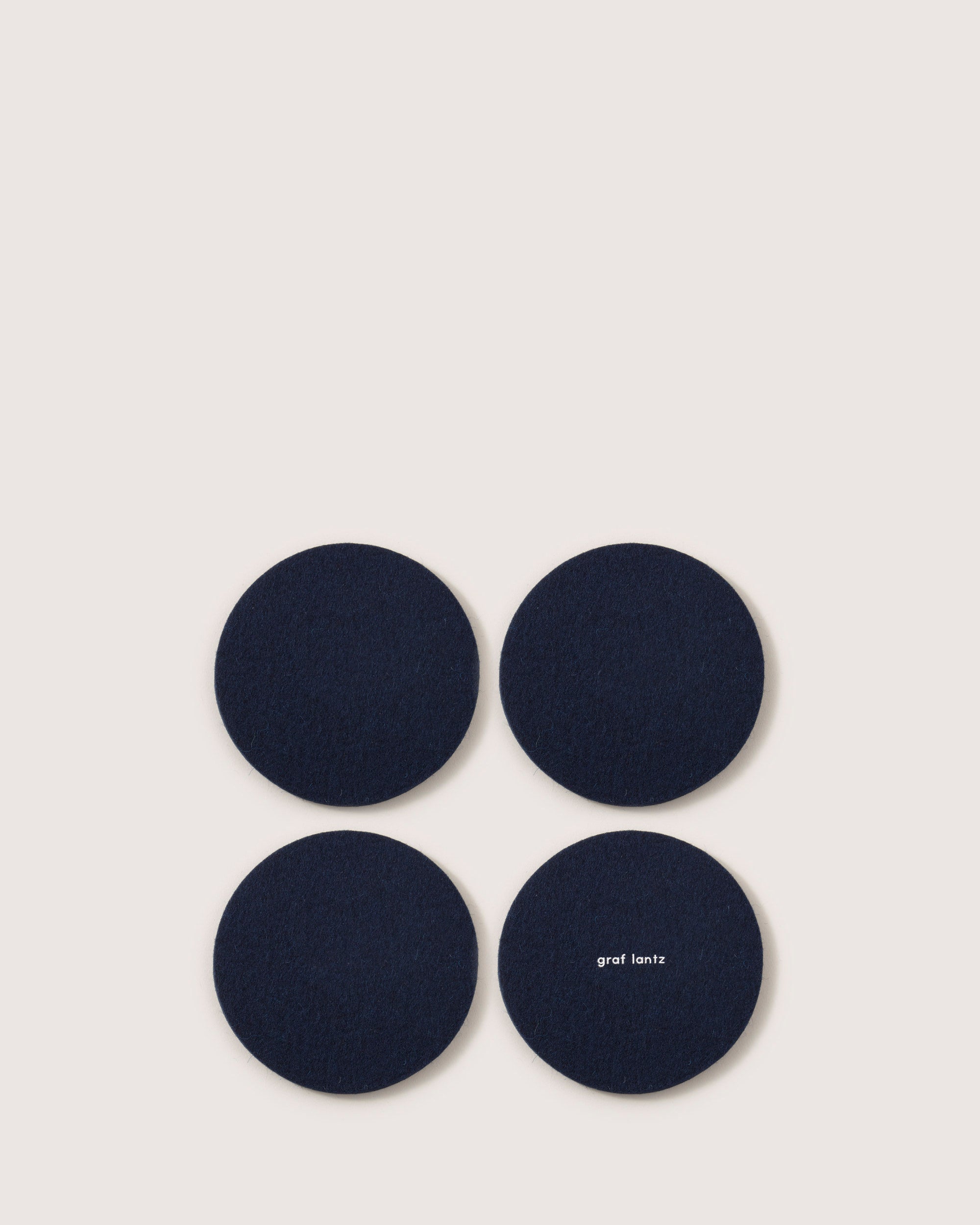 Kobon Leather/Merino Wool Round Tray 4 Pack Coaster Set