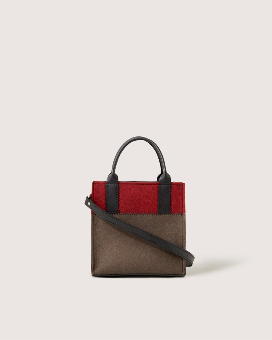 The Graf Lantz small rectangular handbag features black handles, a detachable black shoulder strap, a brown lower half, and a red upper section, shown against a plain light background.