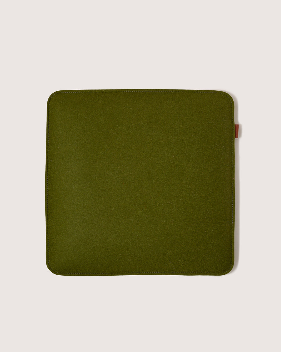 A Zabuton Merino Wool Felt Square Seat Pad by Graf Lantz in Moss Sienna, white background
