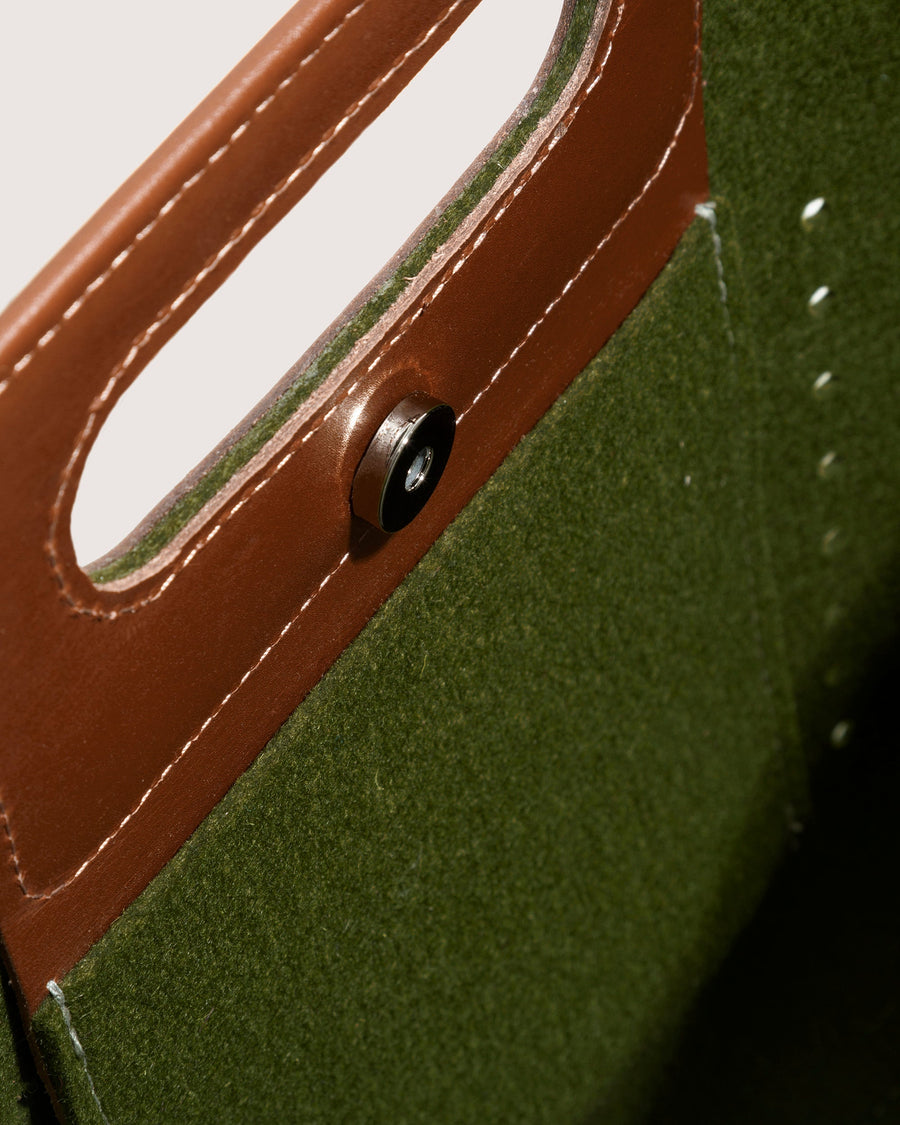 Interior of green Asobi Merino Wool Midi bag with brown leather applications and snap closure by Graf Lantz