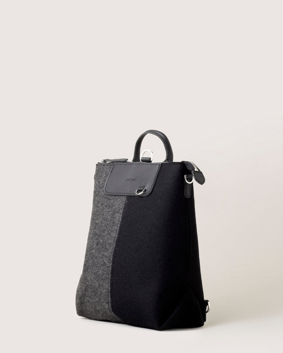 Charcoal and Black colored Bedford Merino Wool Colorblock Midi Backpack by Graf Lantz, side view, white background