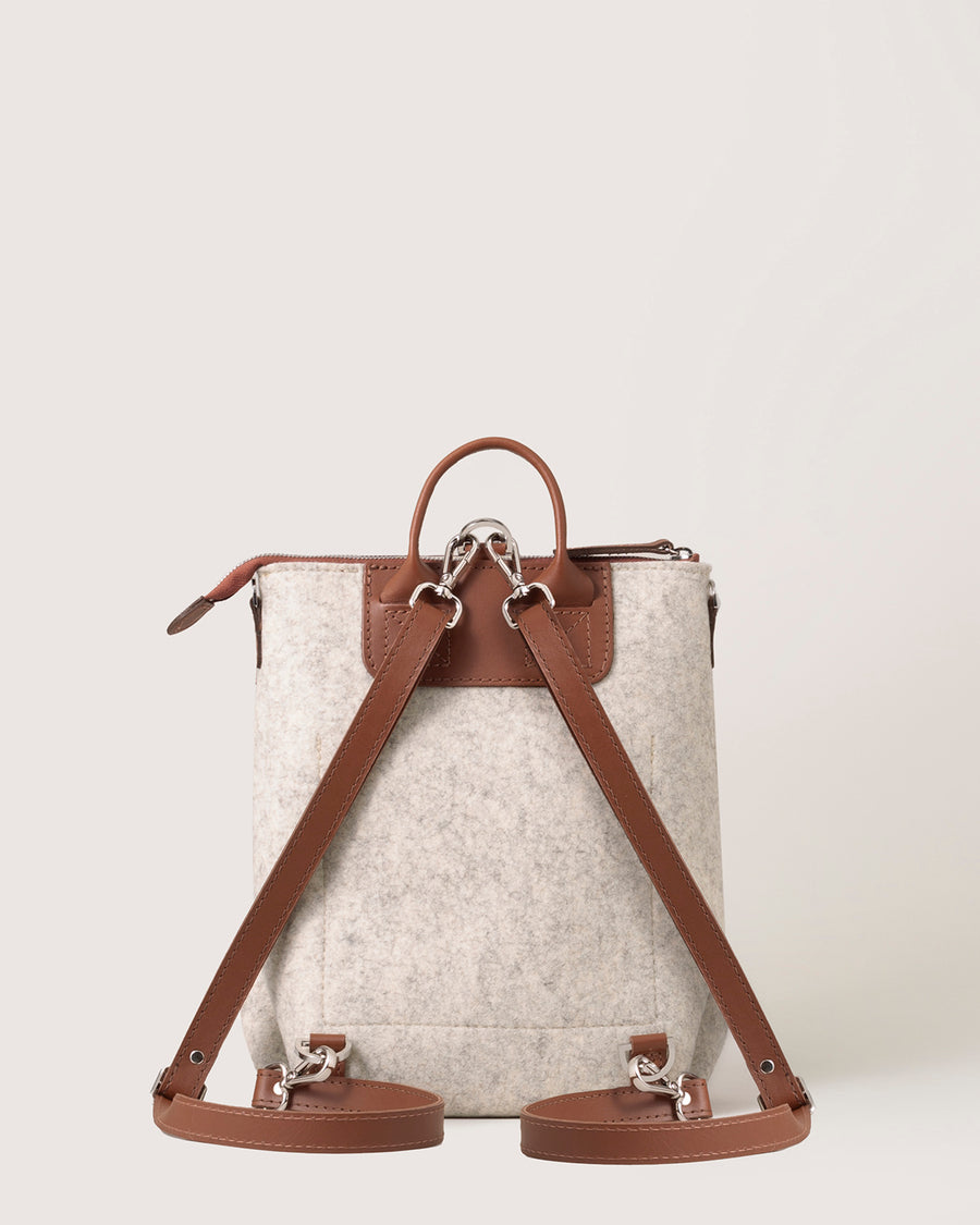 White Bedford Merino Wool Midi Backpack with brown leather straps, rear view, white background