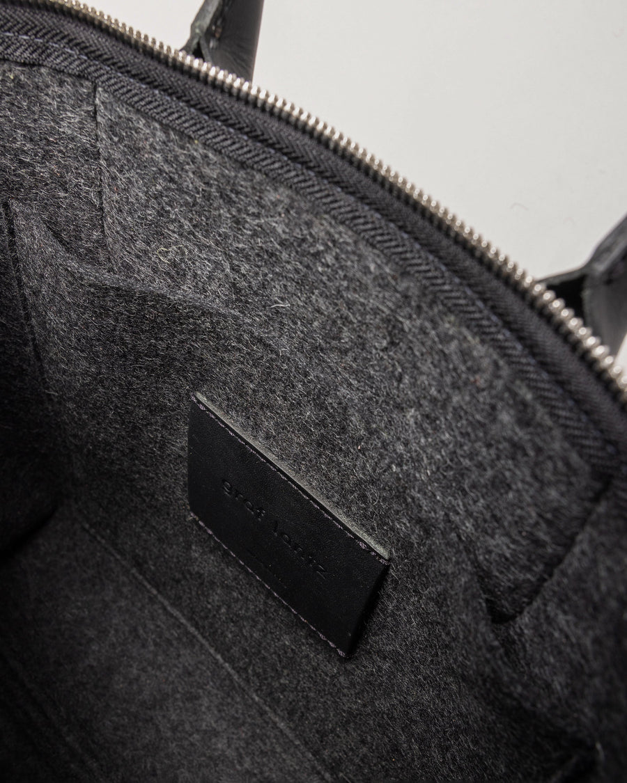 Interior of a Bedford Merino Wool Stachel in Charcoal with black leather accents