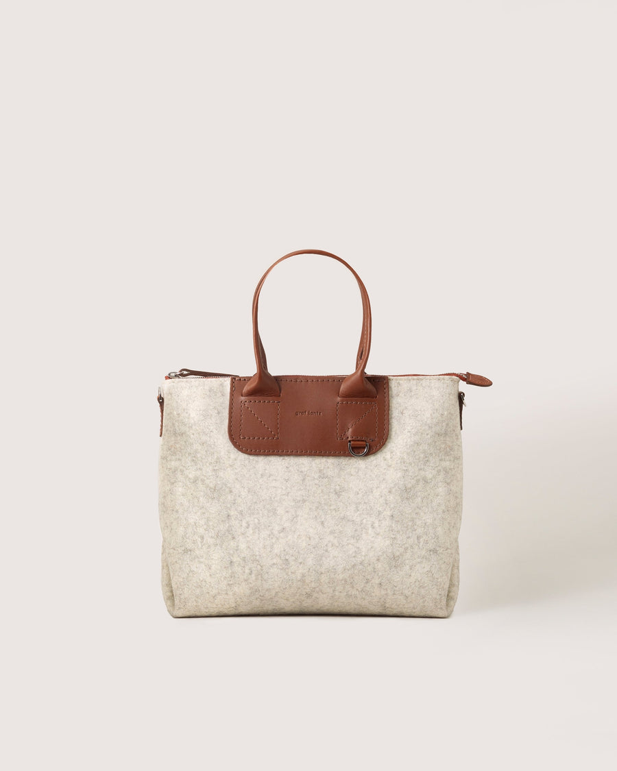 Bedford Merino Wool Satchel in Heather White with brown leather handles, front view, white background