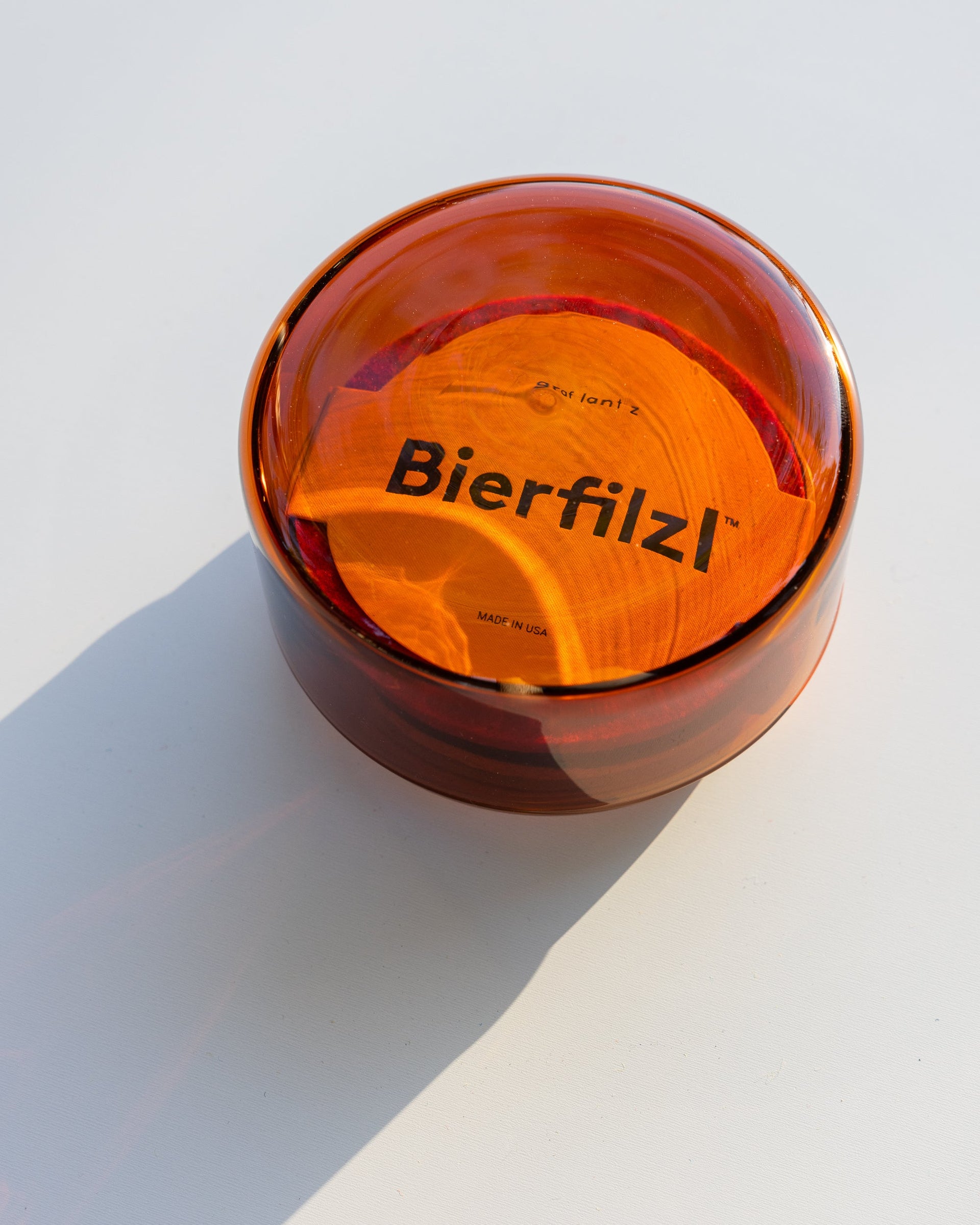 Burnt orange Lidded Container from Borosilicate glass filled with Bierfilzl coasters by Graf Lantz