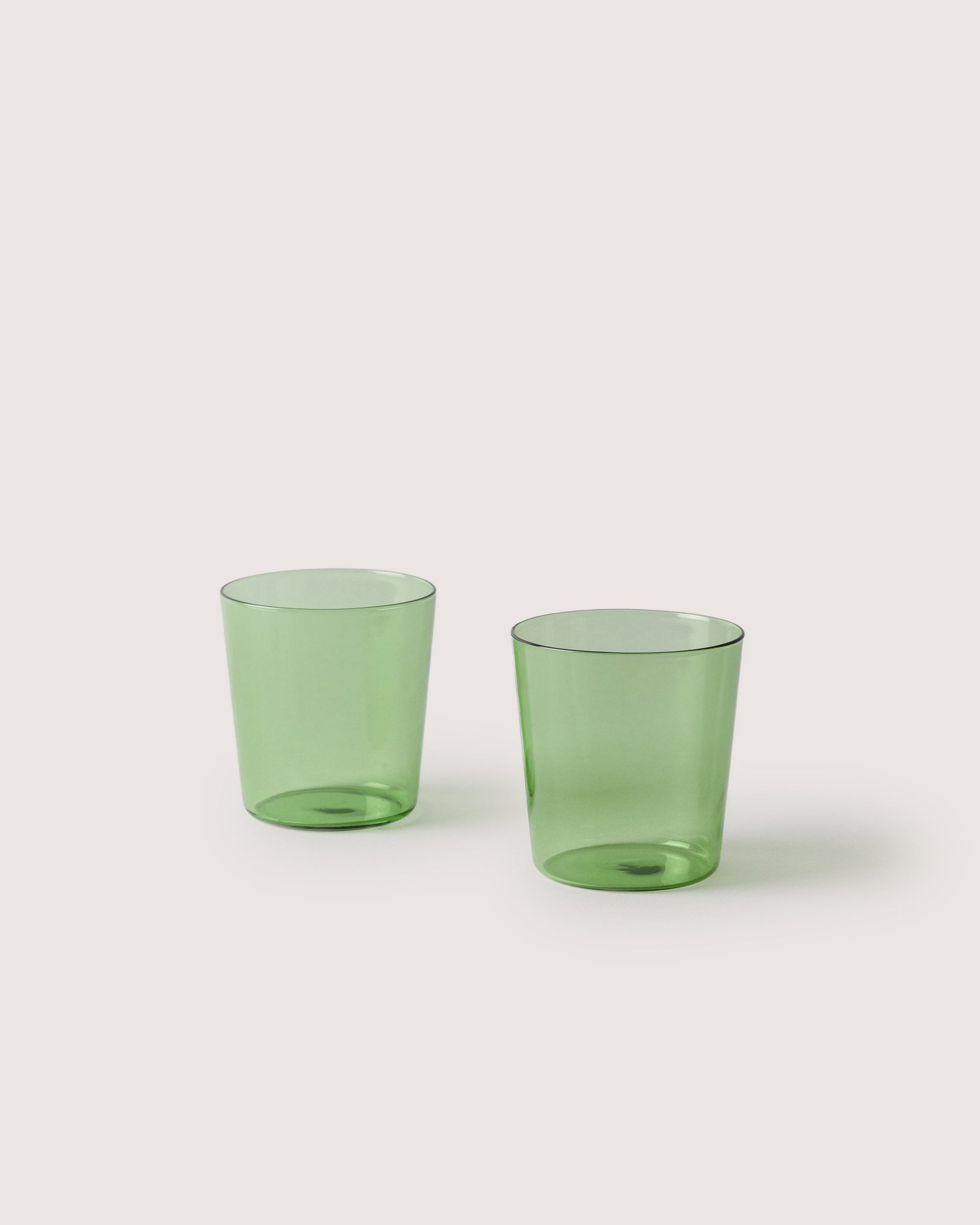 Two small Glas Tumbler in color Cactus, white background