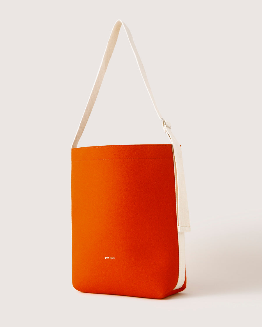 Dressier than a basic tote, but more casual than a handbag: our Campus Merino Wool Felt Tote, here in orange color