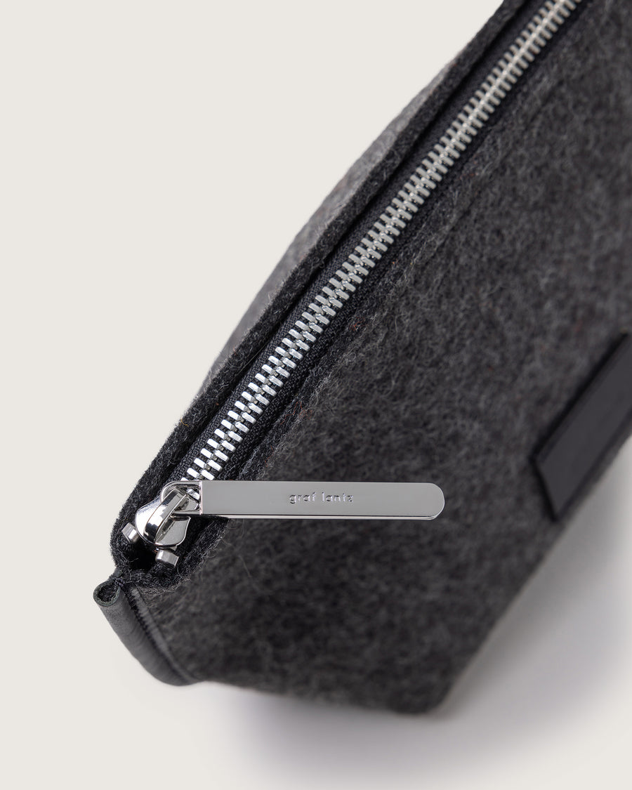 View from above on silver-colored zipper of Hana Merino Wool Pouch in charcoal by Graf Lantz