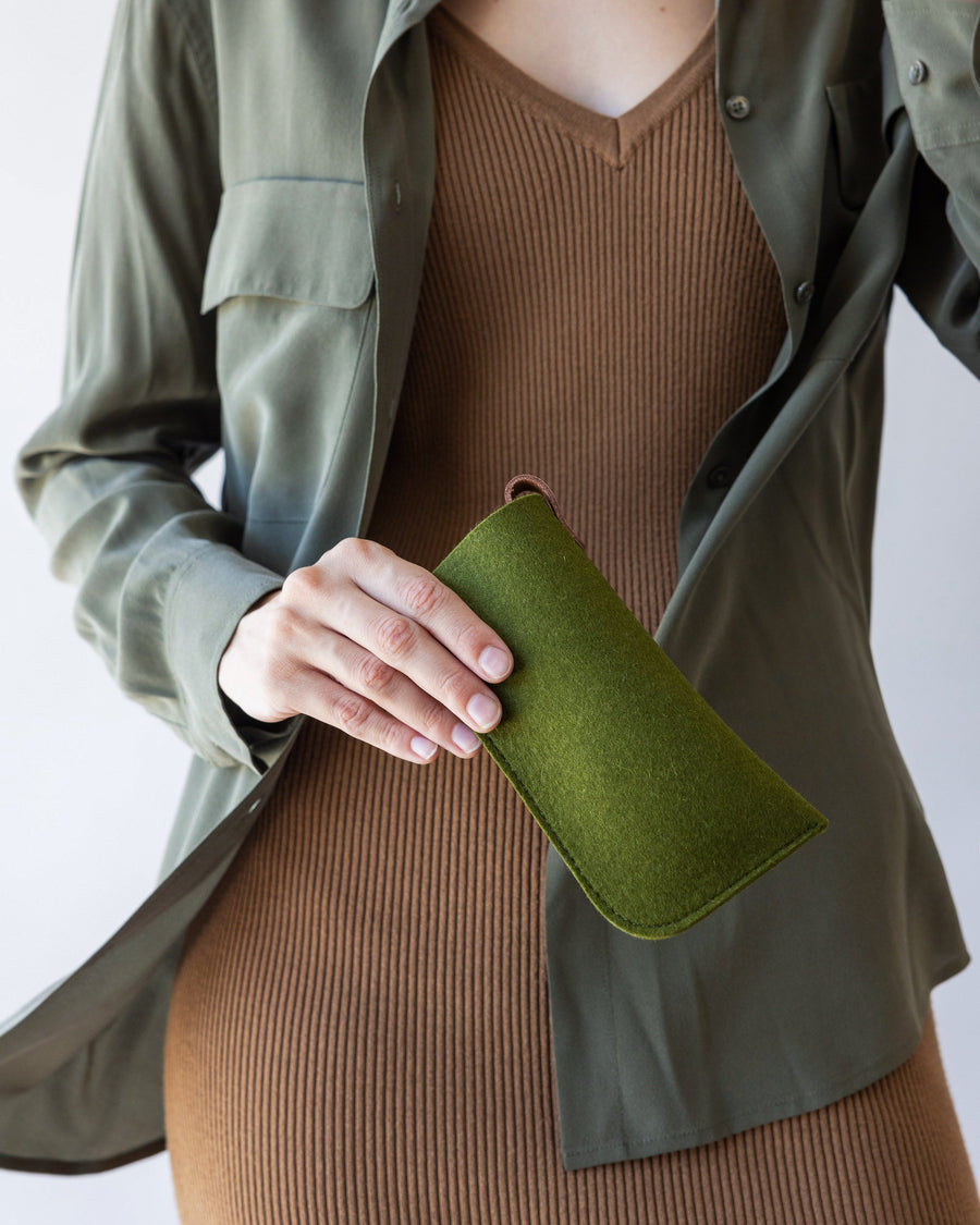 Green Classic Merino Wool Eyeglass Sleeve held by a stylish woman in one hand