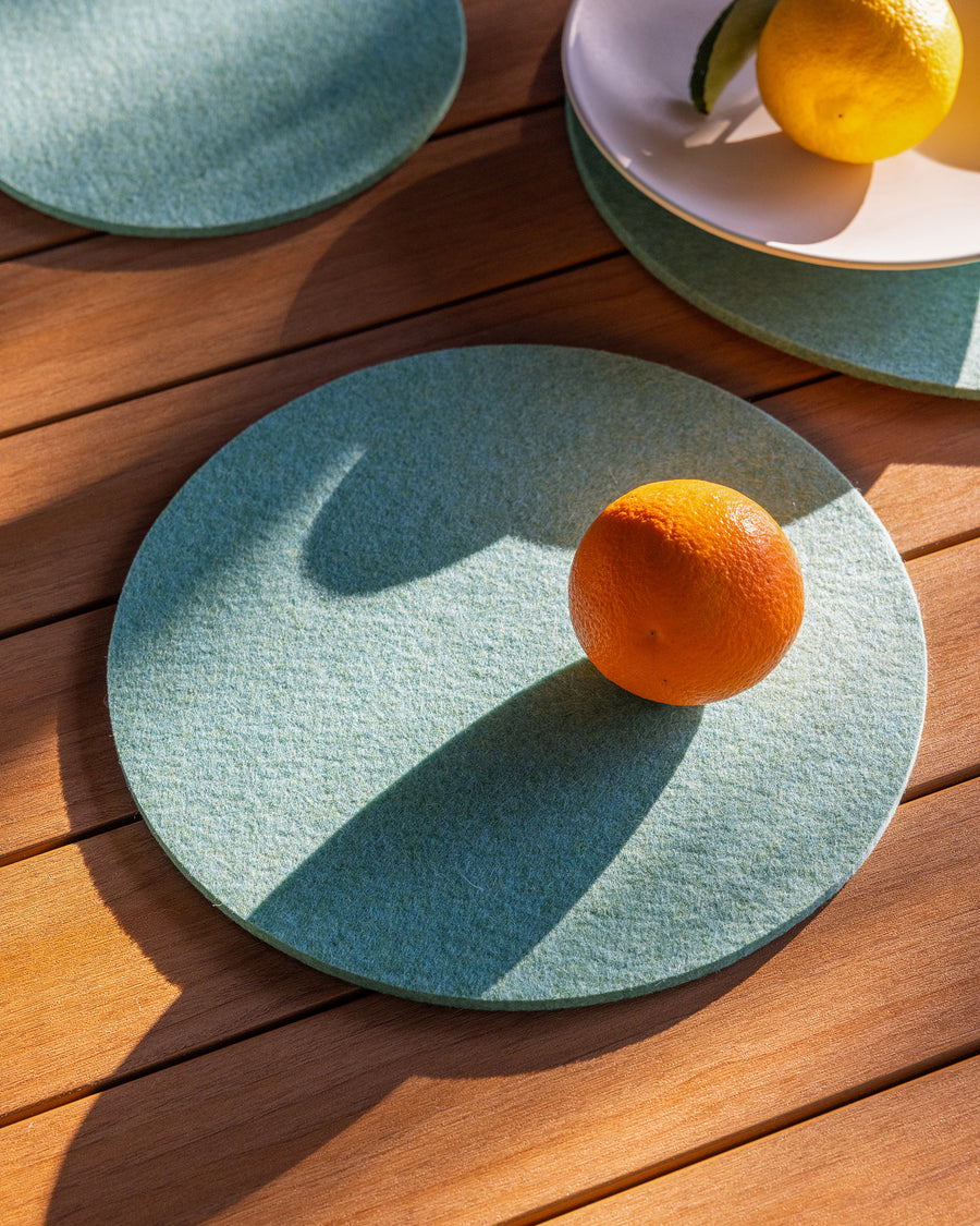 10" round Merino wool felt placemat in a coastal color