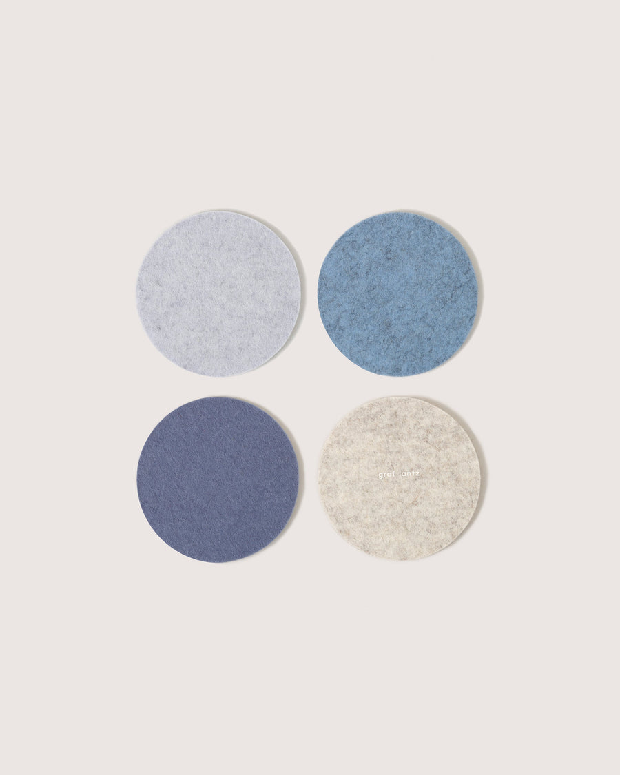 Bierfilzl Merino Wool Round Coaster Multi 4 Pack in Heather Blue, Horizon, Fog and Heather White, white background