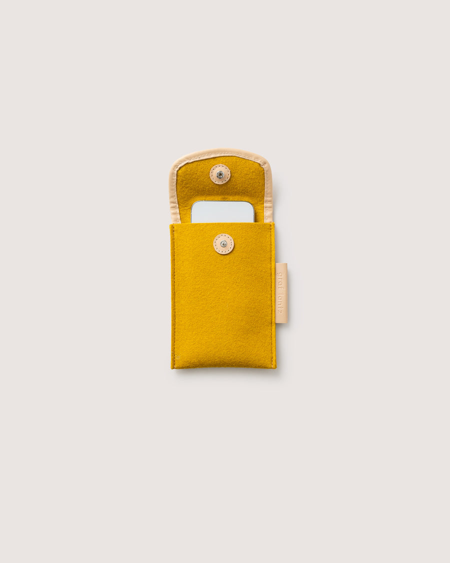 Protect your phone or other small items with our Envelope Accessory Sleeve. Here in dijon color.