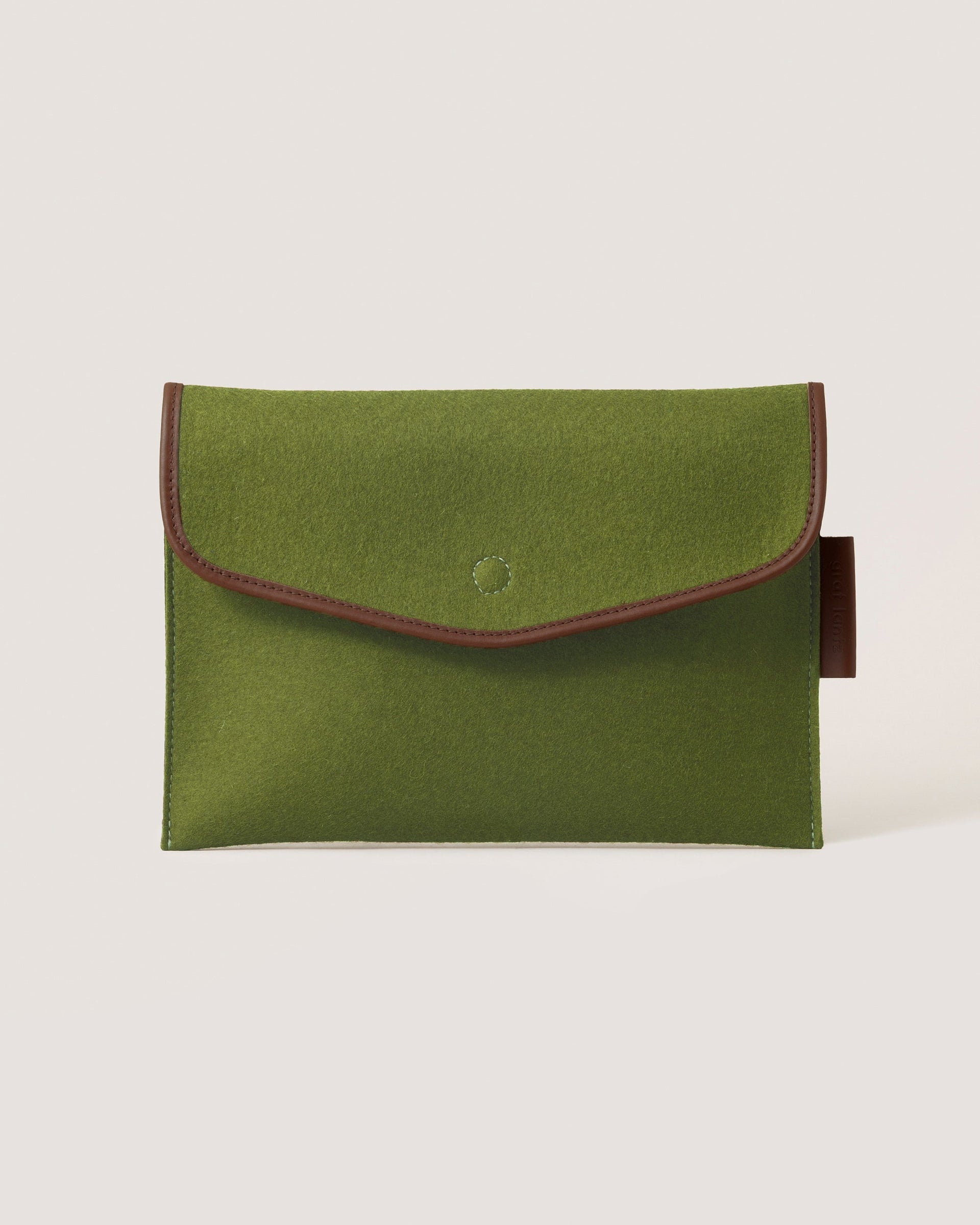 Envelope Merino Wool 14" Tech Sleeve in moss color with dark brown leather application by Graf Lantz, front view