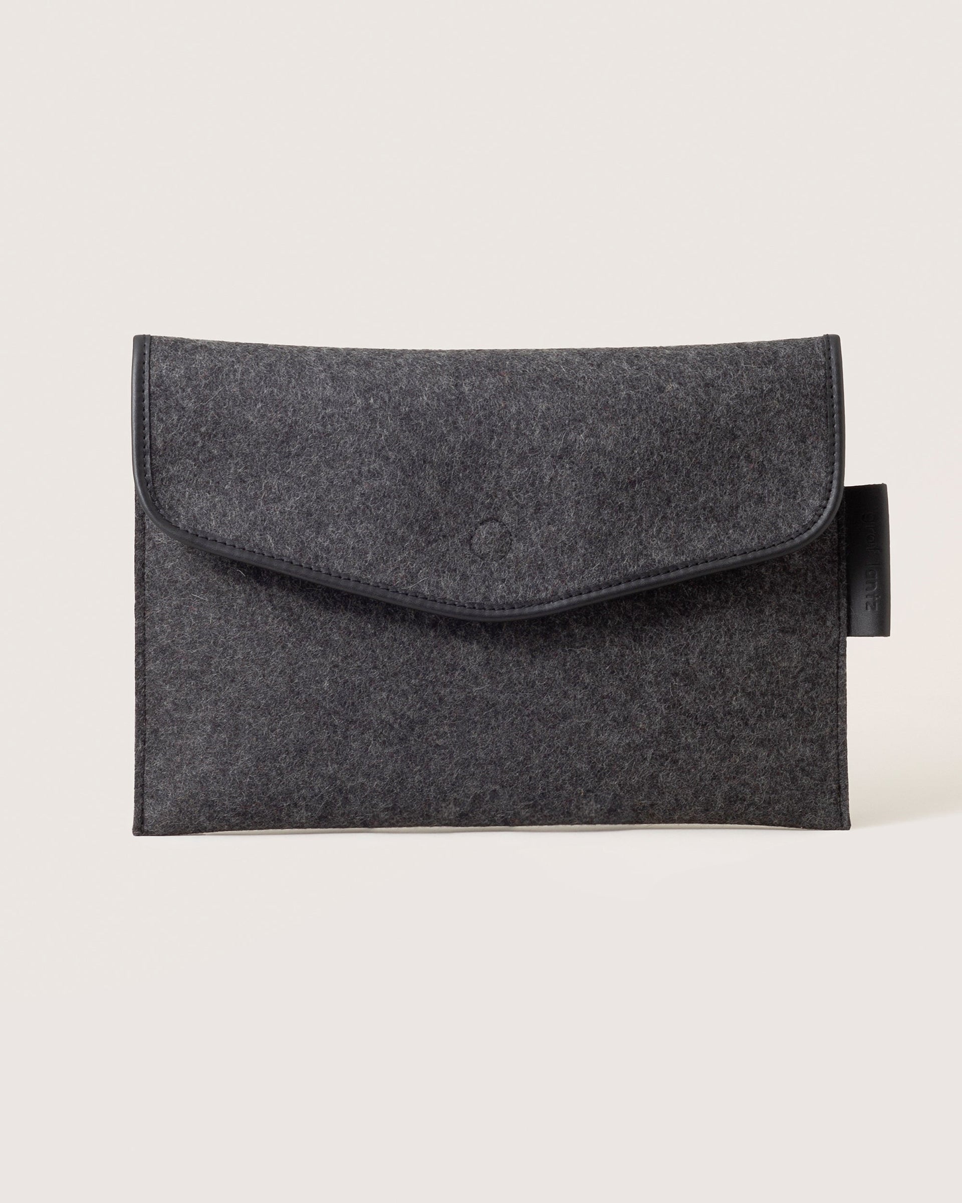 Envelope Merino Wool 16" Tech Sleeve in charcoal color with black leather application by Graf Lantz, front view