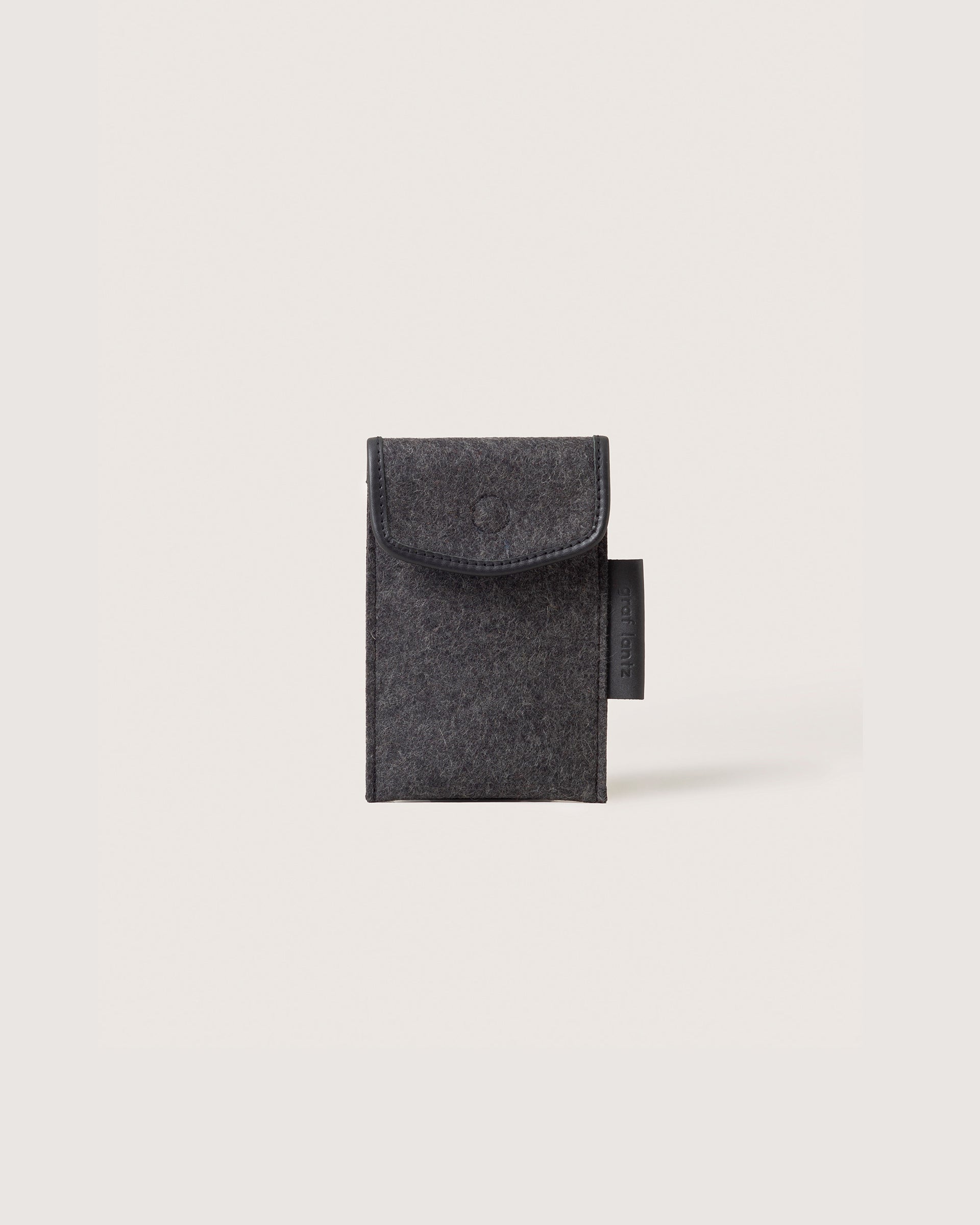 Merino Wool Envelope Accessory Sleeve in charcoal with black leather application, front view