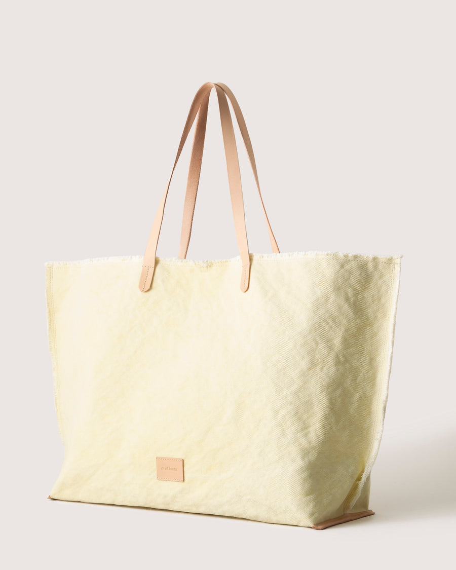 An upscale market tote or weekender travel bag that functions as well as it looks: our Hana Canvas Boat Bag, here in color limoncello