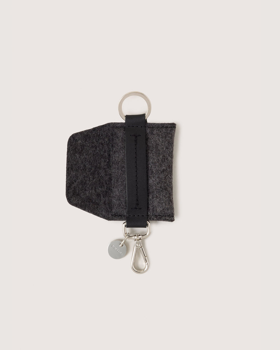 Charcoal colored Merino Wool Card Key Fob by Graf Lantz with pocket flap open, white background.