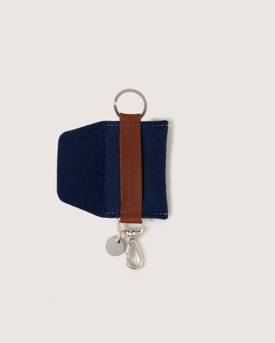 Marine-colored Merino Wool Card Key Fob by Graf Lantz with pocket flap open, white background.