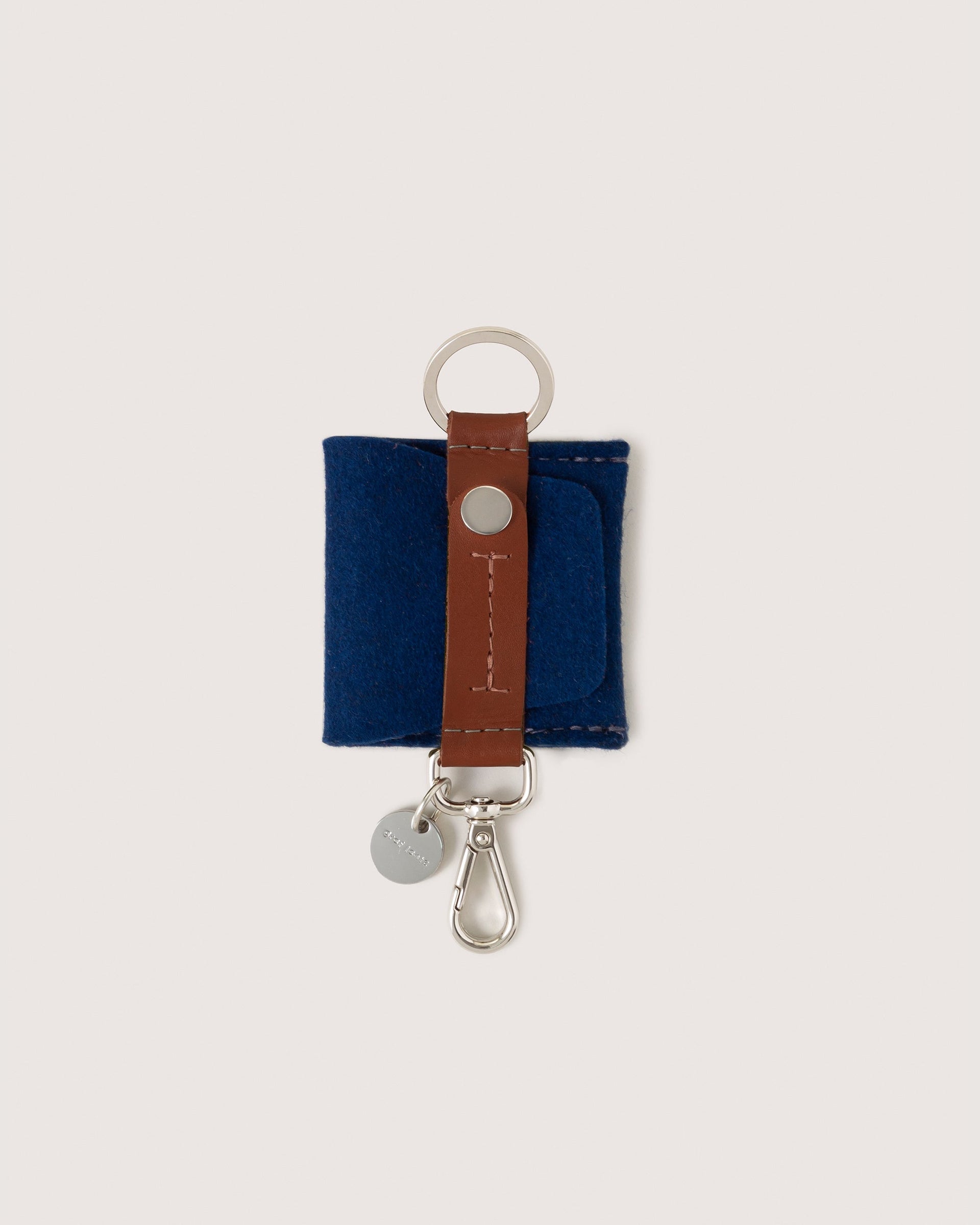 Merino Wool Pod Key Fob by Graf Lantz in Marine and Sienna colors, white background.