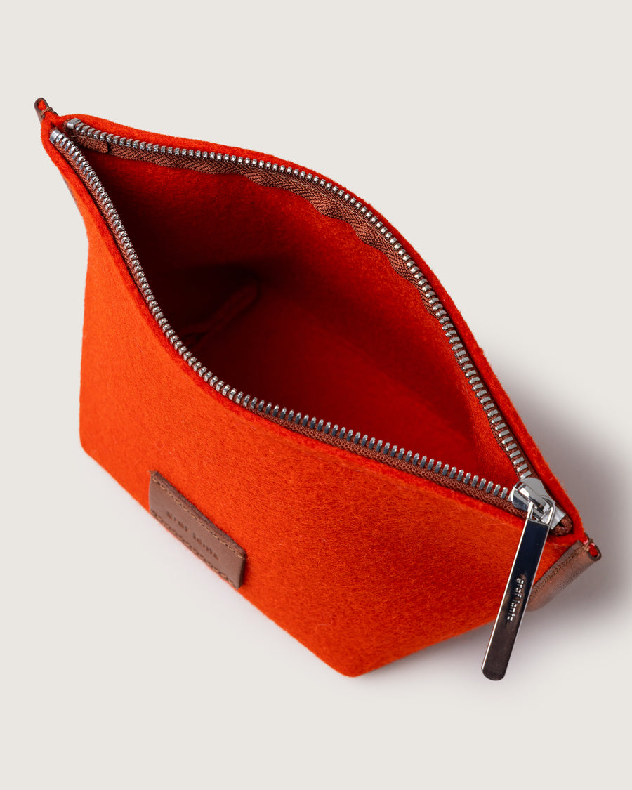 Interior view: opened zipper of orange Hana Merino Wool Pouch