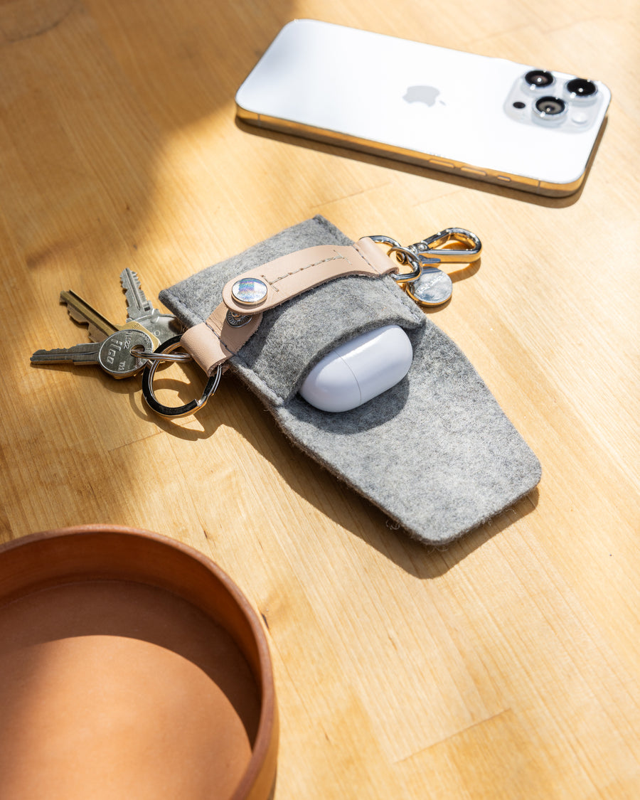 The Pod Fob holds your keys and pods. Here in granite color