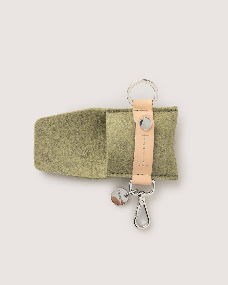 The Pod Fob holds your keys and pods. Here in sage color