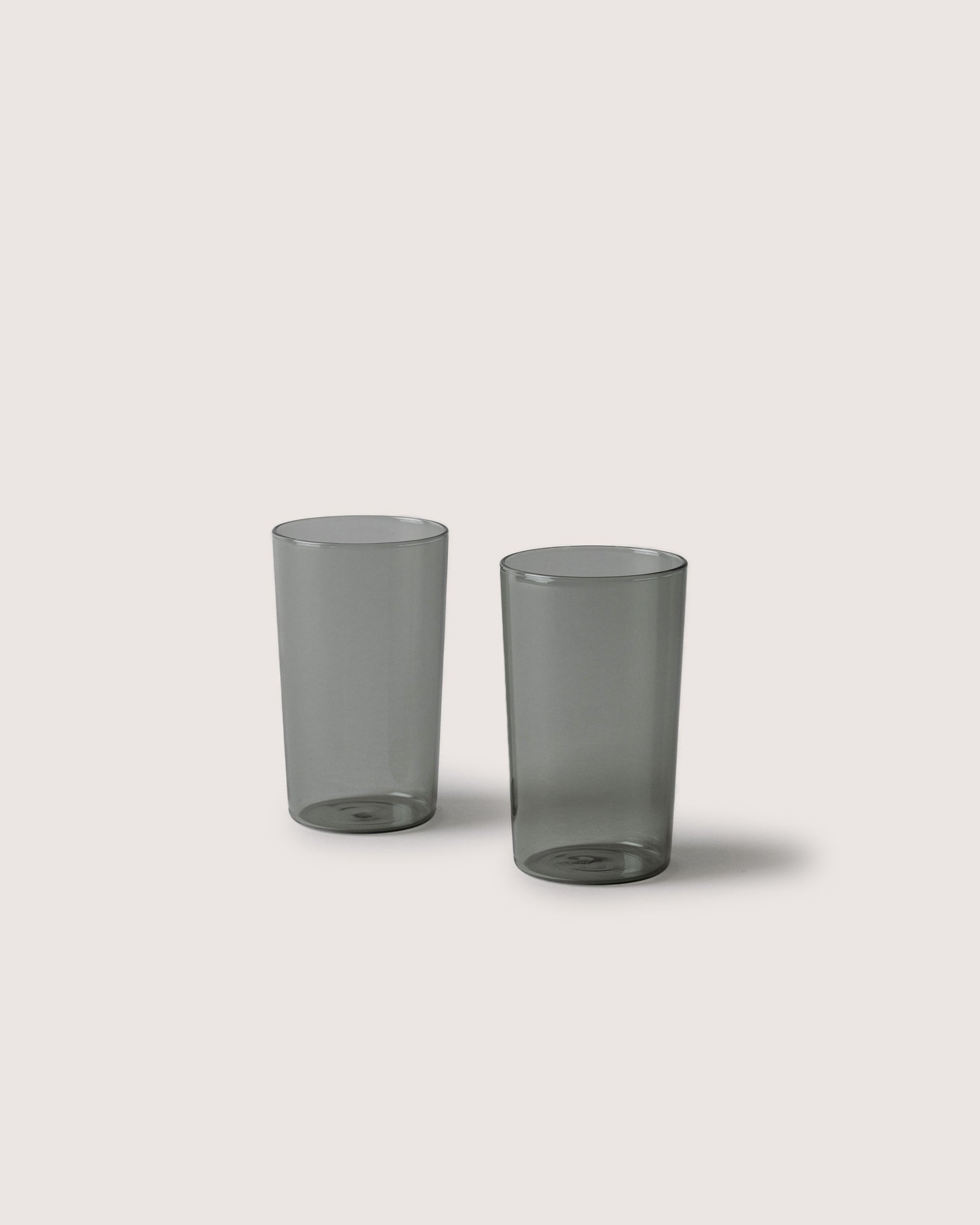 Two narrow Glas Tumbler in color Smoke, white background