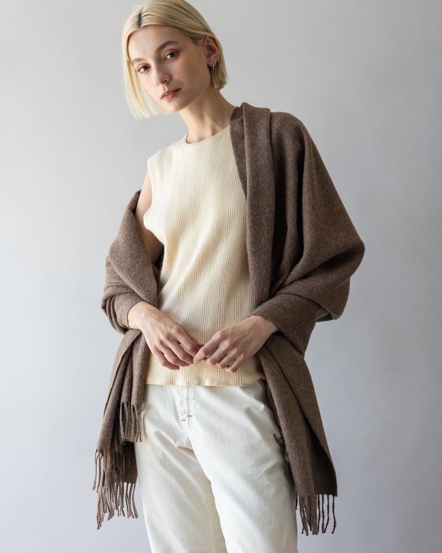 Blonde woman with a brown alpaca throw by Graf Lantz over her shoulders 