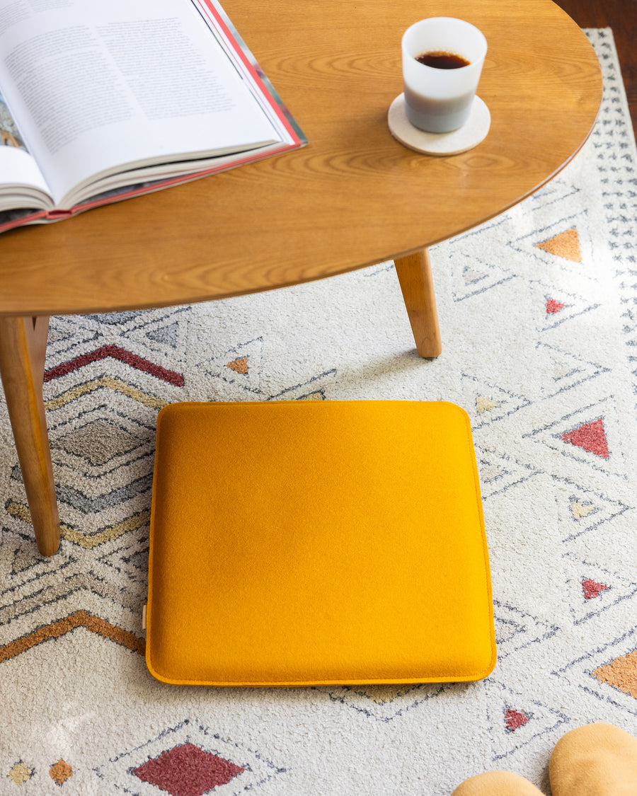 Plush and sturdy: Square Zabutons Seat Pads in a turmeric color